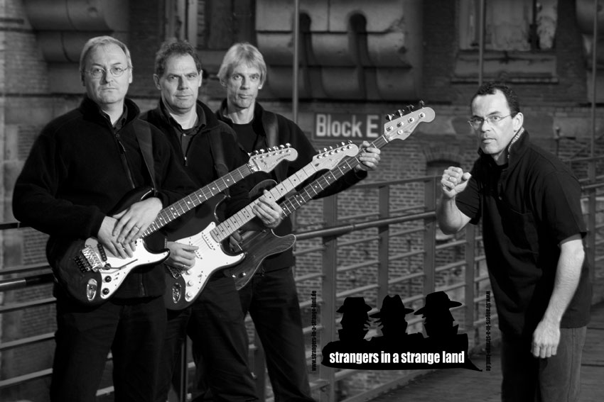 strangers in a strange land cover rock